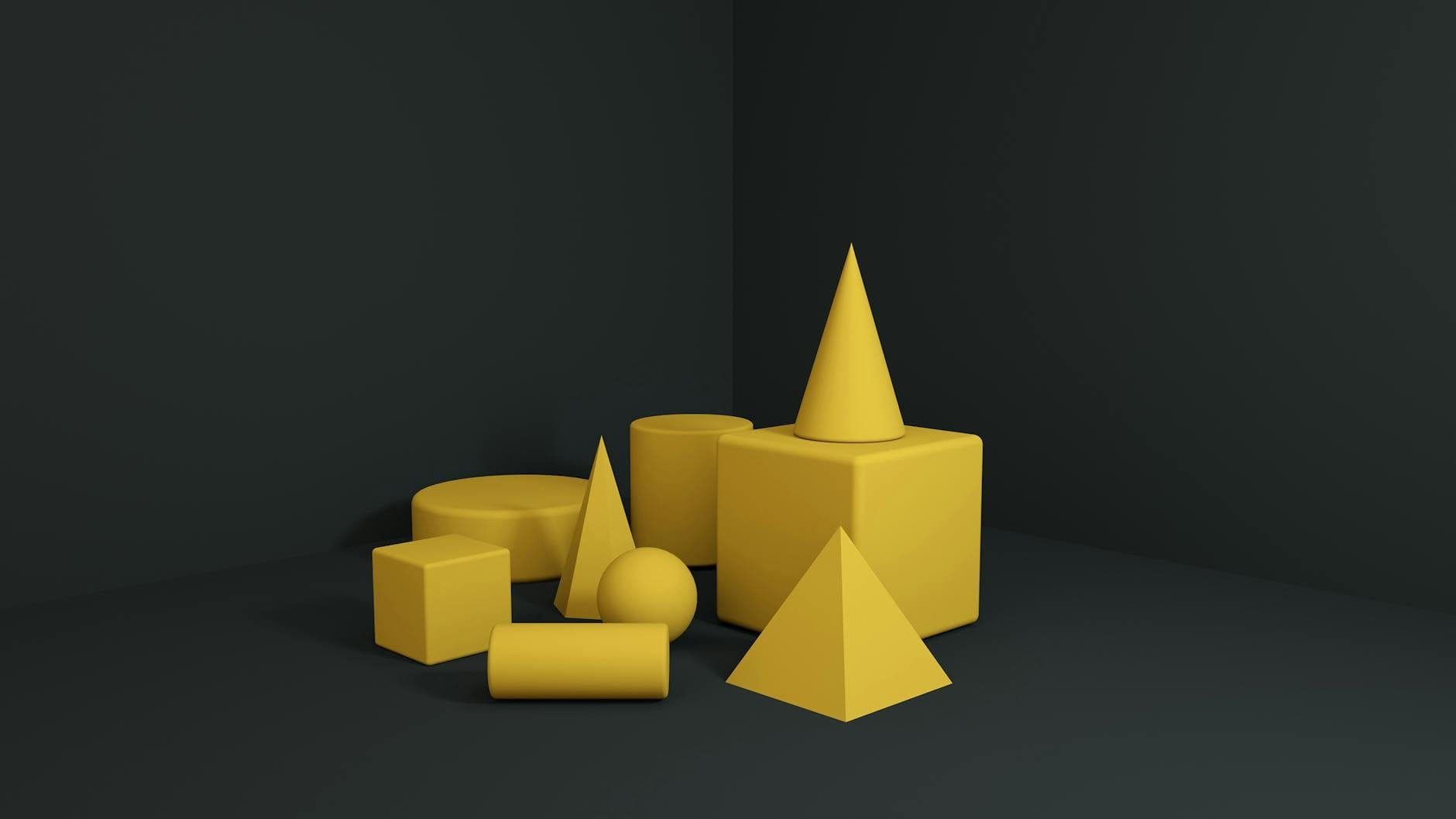 Żółte trójwymiarowe bryły geometryczne na jasnym tle